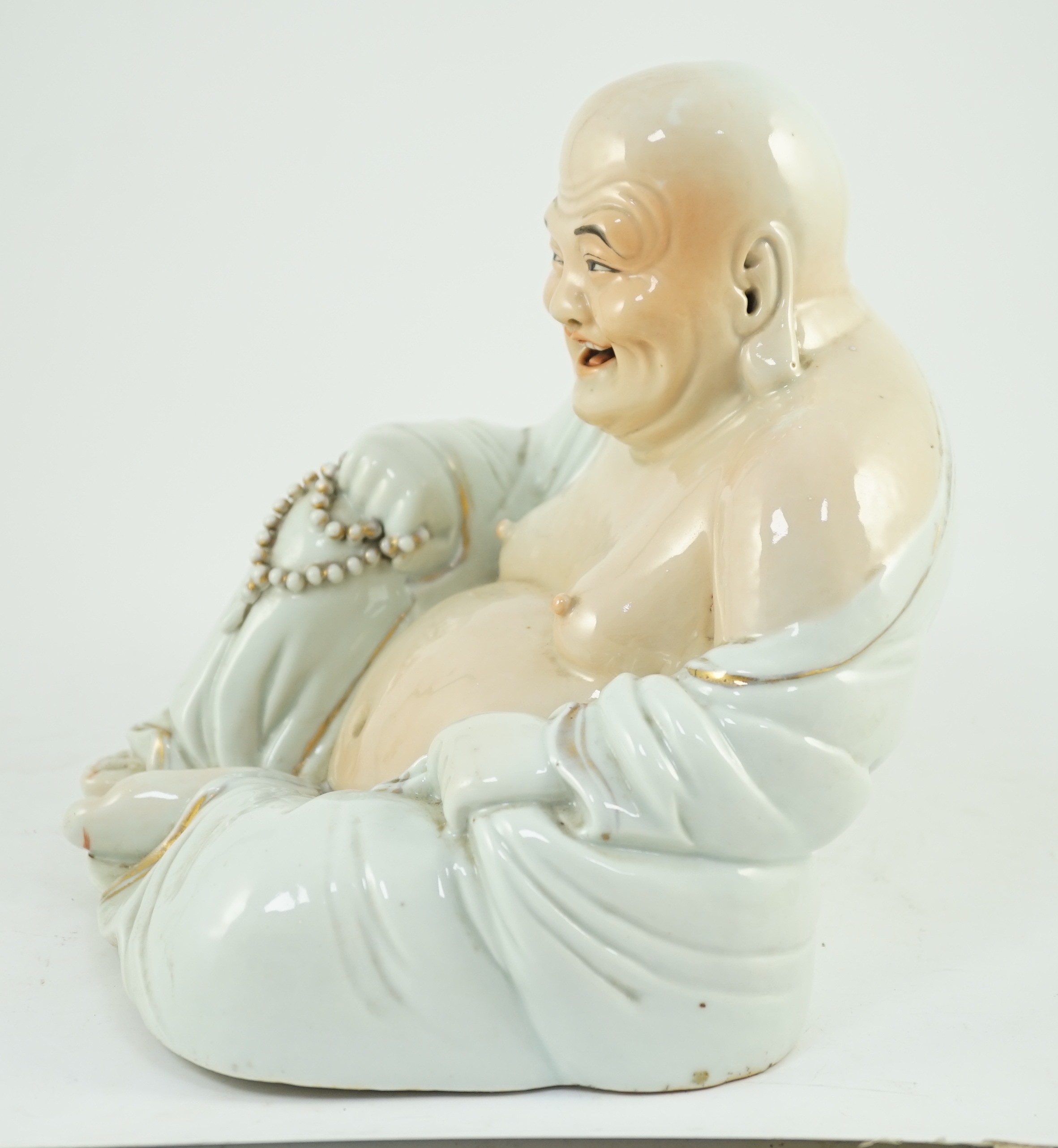 A large Chinese porcelain figure of Budai, Republic period, 25cms high